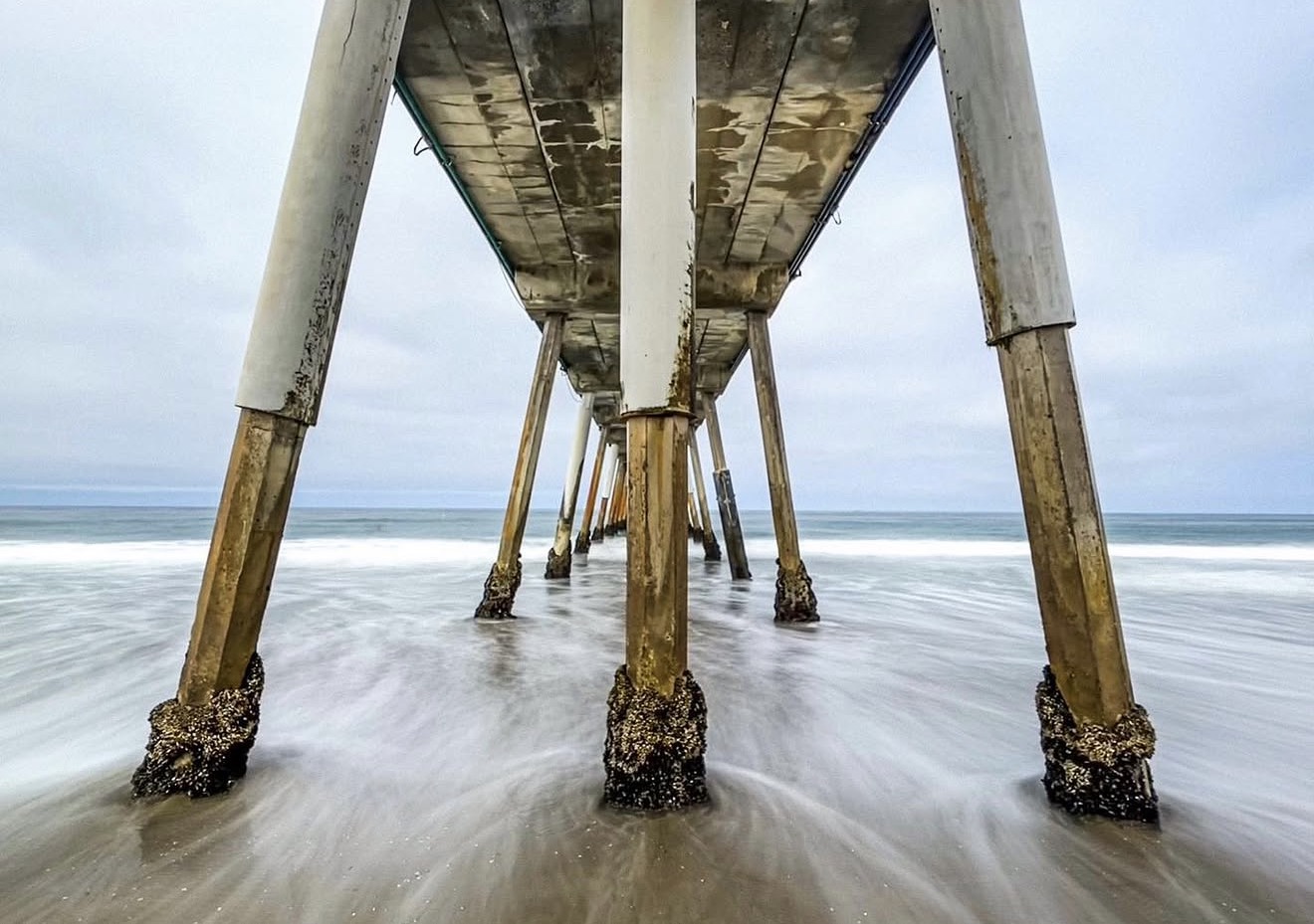 Under Hermosa Beach Pier — photograph by Paul Towers